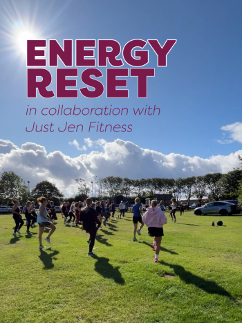 Fitness Event with a group of people running on grass